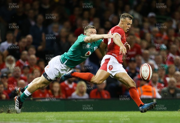 310819 - Wales v Ireland, Under Armour Summer Series 2019 - Jarrod Evans of Wales clears the ball as Andrew Conway of Ireland tackles