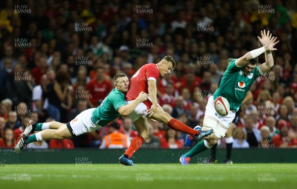 310819 - Wales v Ireland, Under Armour Summer Series 2019 - Jarrod Evans of Wales clears the ball as Andrew Conway of Ireland tackles