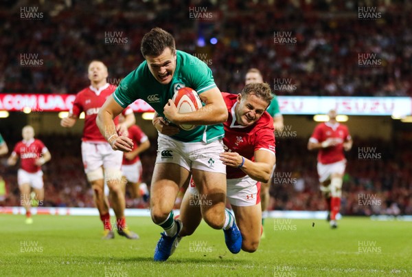 310819 - Wales v Ireland, Under Armour Summer Series 2019 - Jacon Stockade beats Hallam Amos of Wales as he dives in to score his second try