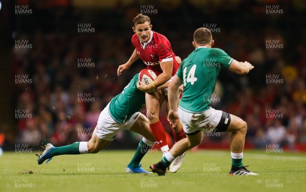 310819 - Wales v Ireland, Under Armour Summer Series 2019 - Hallam Amos of Wales is tackled by Bundee Aki of Ireland as Andrew Conway of Ireland closes in