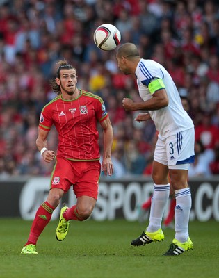 060915 - Wales v Israel - UEFA European Championship Qualifier - Gareth Bale of Wales chalkenges Tal Ben Haim I of Israel