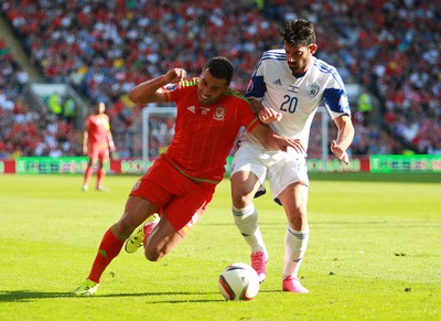 060915 - Wales v Israel - UEFA European Championship Qualifier - Hal Robson-Kanu of Wales is tackled by Omri Ben Harush of Israel