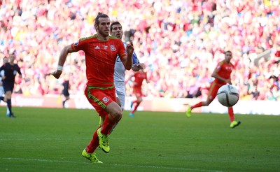060915 - Wales v Israel - UEFA European Championship Qualifier - Gareth Bale of Wales can\t get to the ball quick enough