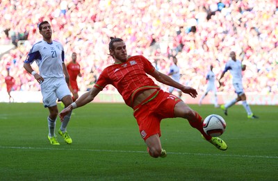 060915 - Wales v Israel - UEFA European Championship Qualifier - Gareth Bale of Wales can\t get to the ball quick enough