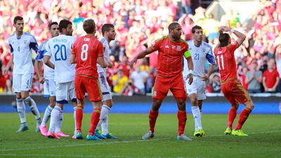 060915 - Wales v Israel - UEFA European Championship Qualifier - Andy King of Wales header almost goes past the goal line