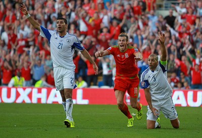 060915 - Wales v Israel - UEFA European Championship Qualifier - Gareth Bale of Wales celebrates prematurely as his last minute goal is disallowed