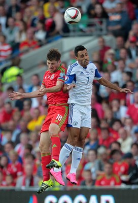 060915 - Wales v Israel - UEFA European Championship Qualifier - Ben Davies of Wales goes up for the header with Eran Zahavi of Israel