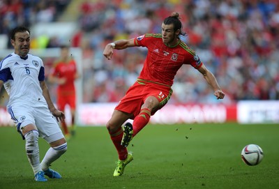 060915 - Wales v Israel, UEFA European Championship 2016 Qualifying match - Gareth Bale of Wales lis challenged by Bibras Natcho of Israel