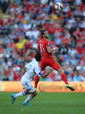 060915 - Wales v Israel, UEFA European Championship 2016 Qualifying match - Gareth Bale of Wales gets above Orel Dgani of Israel to head the ball forward