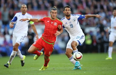060915 - Wales v Israel, UEFA European Championship 2016 Qualifying match - Gareth Bale of Wales and Orel Dgani of Israel compete for the ball