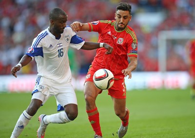 060915 - Wales v Israel, UEFA European Championship 2016 Qualifying match - Neil Taylor of Wales is challenged by Eliazer Dasa of Israel
