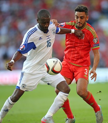 060915 - Wales v Israel, UEFA European Championship 2016 Qualifying match - Neil Taylor of Wales is challenged by Eliazer Dasa of Israel