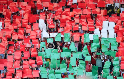 060915 - Wales v Israel, UEFA European Championship 2016 Qualifying match - Wales fans hold aloft coloured cards to spell CYMRU during the Welsh national anthem
