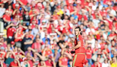 060915 - Wales v Israel, UEFA European Championship 2016 Qualifying match - Gareth Bale of Wales in front of the home supporters during the match