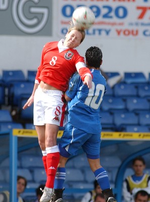 300306 - Wales v Israel - FIFA Women's World Cup - Euro Group 8 Wales' Jayne Ludlow heads away from Anat Maimoni 