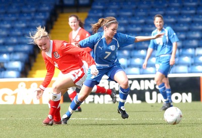 300306 - Wales v Israel - FIFA Women's World Cup - Euro Group 8 Israel's Rebecca Joy Glueck is tackled Katie Daley 