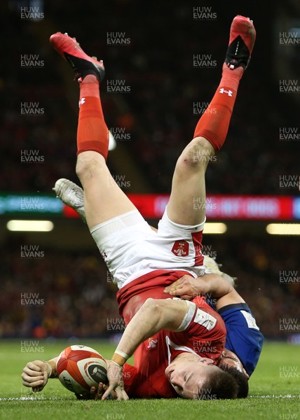 010220 - Wales v Italy - Guinness 6 Nations - Josh Adams of Wales is upside down as he scores a try at the end of the game