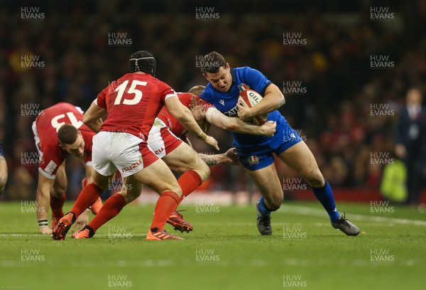 010220 - Wales v Italy, Guinness Six Nations -   Luca Morisi of Italy is tackled by Johnny McNicholl of Wales and Leigh Halfpenny of Wales