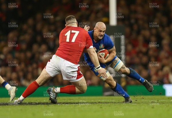 010220 - Wales v Italy, Guinness Six Nations -   Marco Lazzaroni of Italy is tackled by Rob Evans of Wales