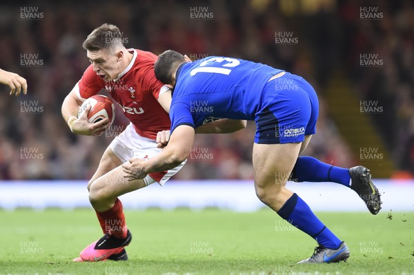 010220 - Wales v Italy - Guinness Six Nations - Josh Adams of Wales is tackled by Luca Morisi of Italy  
