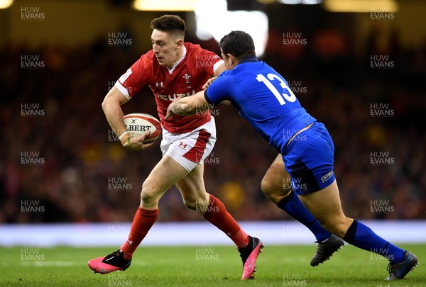 010220 - Wales v Italy - Guinness Six Nations - Josh Adams of Wales is tackled by Luca Morisi of Italy 