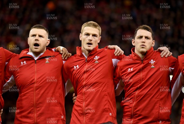 010220 - Wales v Italy - Guinness Six Nations - Rob Evans, Johnny McNicholl and Ryan Elias of Wales during the anthem