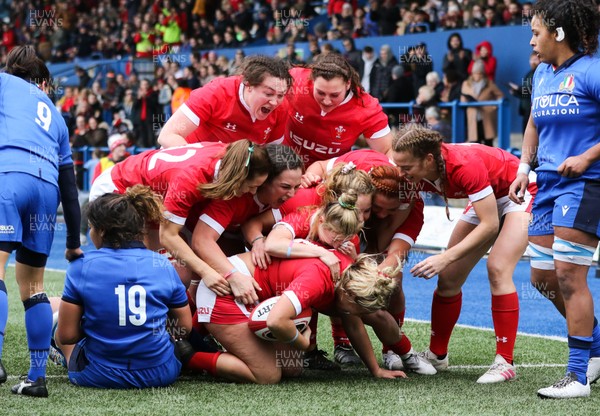 020220 - Wales v Italy, 2020 Women's Six Nations - Team mates congratulate Kelsey Jones of Wales after she powers over to score try