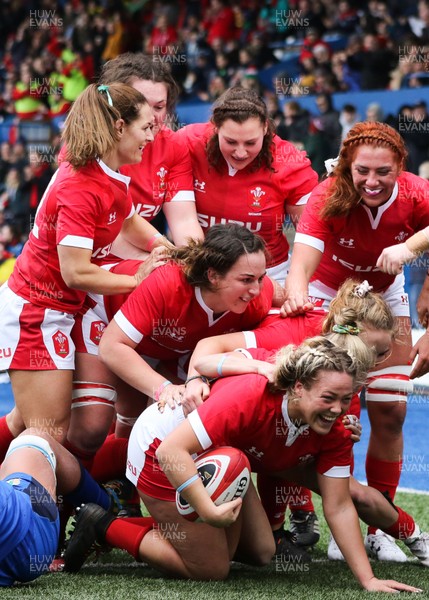 020220 - Wales v Italy, 2020 Women's Six Nations - Team mates congratulate Kelsey Jones of Wales after she powers over to score try