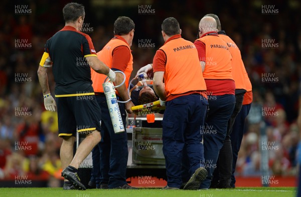 050915 -  Wales v Italy - Dove Men Test 2015 -Leigh Halfpenny of Wales is treated before leaving the field