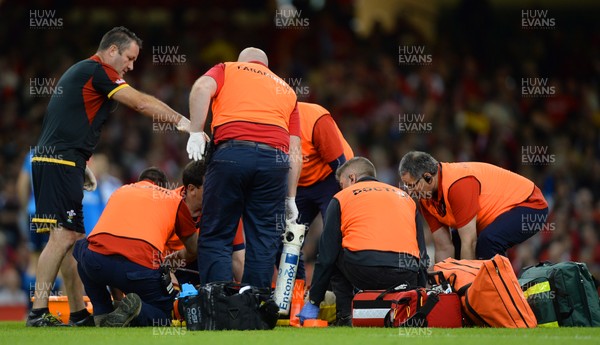 050915 -  Wales v Italy - Dove Men Test 2015 -Leigh Halfpenny of Wales is treated before leaving the field