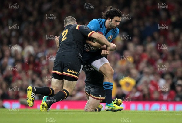 050915 - Wales v Italy - Dove Men Test - Luke McLean of Italy is tackled by Ken Owens and Gethin Jenkins of Wales