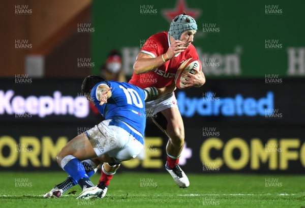 051220 - Wales v Italy - Autumn Nations Cup - Jonathan Davies of Wales is tackled by Paolo Garbisi of Italy