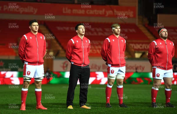 051220 - Wales v Italy - Autumn Nations Cup - James Botham, Josh Adams, Aaron Wainwright and Wyn Jones of Wales during the anthems 