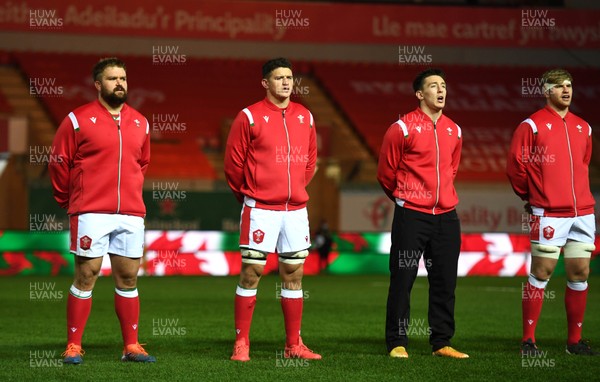 051220 - Wales v Italy - Autumn Nations Cup - Tomas Francis, James both and Josh Adams of Wales during the anthems 