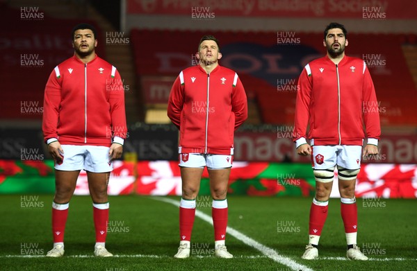 051220 - Wales v Italy - Autumn Nations Cup - Leon Brown, Elliot Dee and Cory Hill of Wales during the anthems 