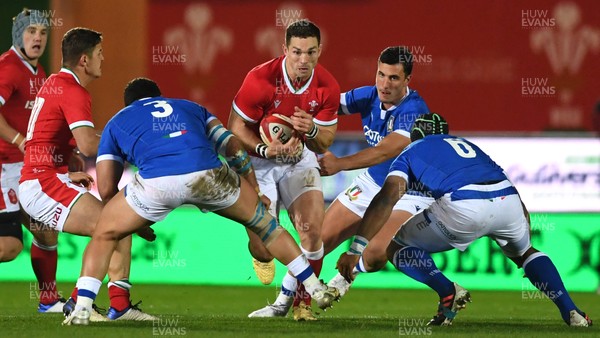 051220 - Wales v Italy - Autumn Nations Cup - George North of Wales is tackled by Giosue Zilocchi and Maxime Mbanda of Italy