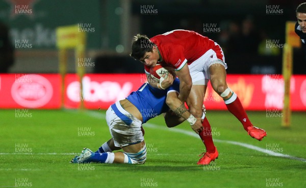 051220 - Wales v Italy, Autumn Nations Cup 2020 - Louis Rees-Zammit of Wales is tackled by Luca Sperandio of Italy