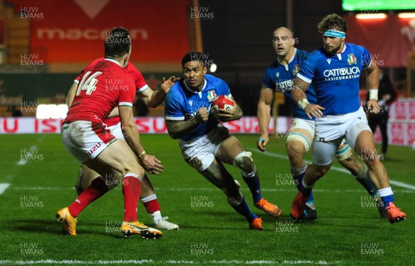 051220 - Wales v Italy, Autumn Nations Cup 2020 - Montanna Ioane of Italy is stopped by Josh Adams of Wales and Gareth Davies of Wales