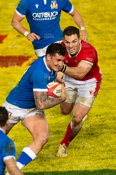 051220 - Wales v Italy - Autumn Nations Cup 2020 - Marco Zanon of Italy hands off George North of Wales 