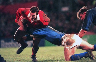 070298 - Wales v Italy - Italy Tour -  New Welsh captain Rob Howley is tackled by Alessandro Troncon