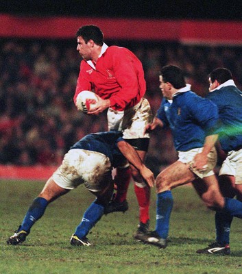 070298 - Wales v Italy - Italy Tour -  Mike Voyle of Wales is tackled by Giambattista Croci 