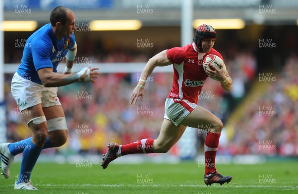 100312 - Wales v Italy - RBS Six Nations 2012 -Leigh Halfpenny of Wales is tackled by Sergio Parisse of Italy