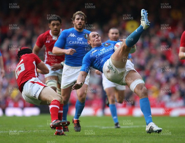 100312 -  Wales v Italy, RBS 6 Nations - Wales' Leigh Halfpenny pulls back Italy's Sergio Parisse leading to Halfpennys yellow card