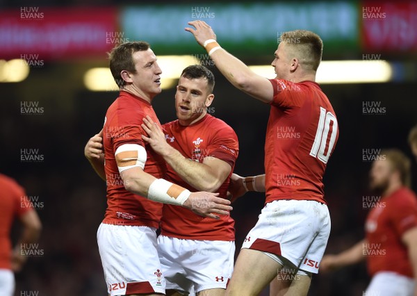 110318 - Wales v Italy - NatWest 6 Nations 2018 - Hadleigh Parkes of Wales celebrates his try with Gareth Davies and Gareth Anscombe