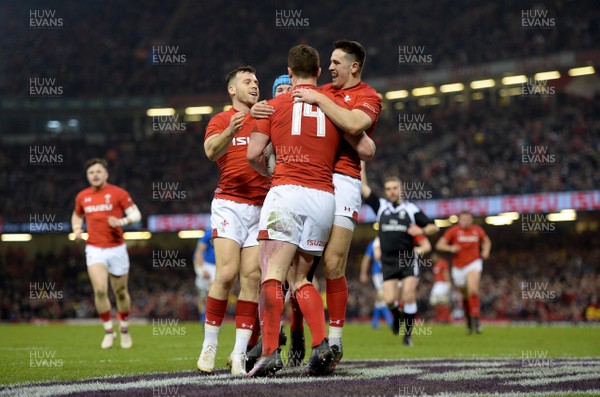 110318 - Wales v Italy - NatWest 6 Nations 2018 - George North of Wales celebrates his try with Gareth Davies and Owen Watkin