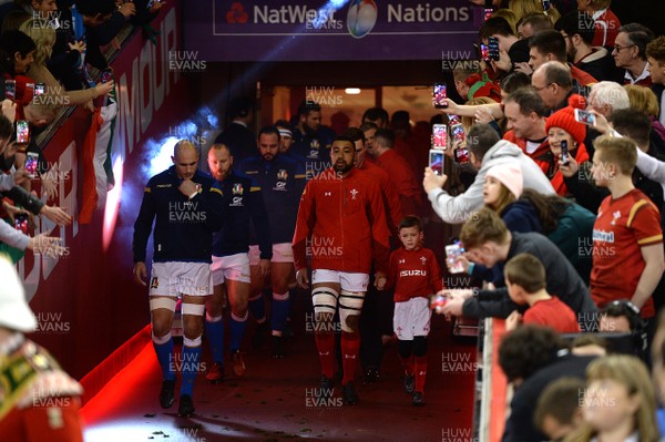 110318 - Wales v Italy - NatWest 6 Nations 2018 - Taulupe Faletau of Wales leads out his side with mascot