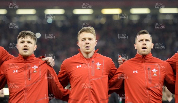 110318 - Wales v Italy - NatWest 6 Nations 2018 - Steff Evans, James Davies and Gareth Davies during the anthems