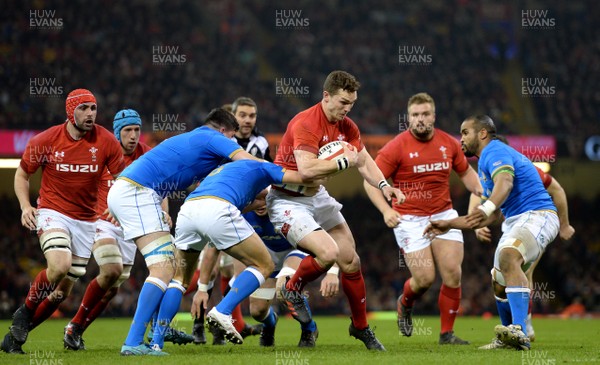 110318 - Wales v Italy - NatWest 6 Nations 2018 - George North of Wales is tackled by Marcello Violi of Italy