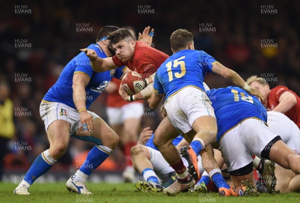 110318 - Wales v Italy - NatWest 6 Nations 2018 - Steff Evans of Wales is tackled by Matteo Minozzi of Italy