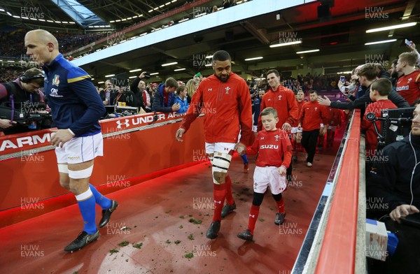 110318 - Wales v Italy - Natwest 6 Nations Championship - Taulupe Faletau of Wales runs out with mascot
